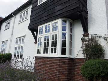 Mr & Mrs L. Lower Heswall Wirral : Installation of whitewood 2800 PvcU windows with astragal bar design design glass and Dummy vets to match the original timber windows Aluminium windows Formby Liverpool including Formby Bi folding doors